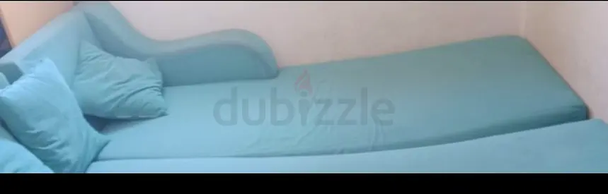 Light blue single bed / daybed with cushions - good condition.9 seaterplus alamarah .Total 4 items .