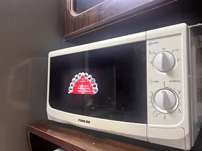 Used Nikai Microwave Oven - Compact Manual Model