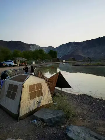 Family camping tent setup by the lake - sturdy 4-6 person tent