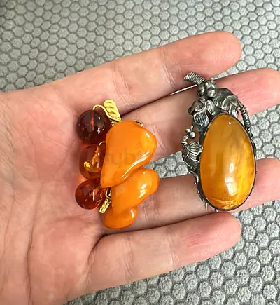 Two brooches with Amber and silver