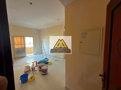 A spacious one-bedroom apartment with a living room, balcony, and closed kitchen. The property offers a practical layout, central air conditioning, an