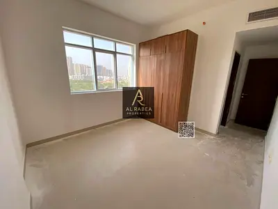 For annual rent in Ajman, in Princess Village: two bedrooms, a living room, two bathrooms, and built-in wardrobes.
