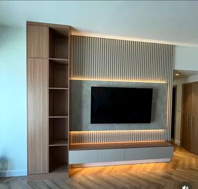 Custom built-in TV entertainment unit with shelving and LED lighting