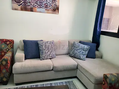 Light grey L-shaped fabric sofa with chaise, 3-seater