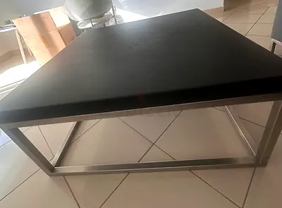 Square black table with stainless steel frame