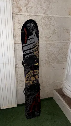 Used kid/teen snowboard with bindings — good condition