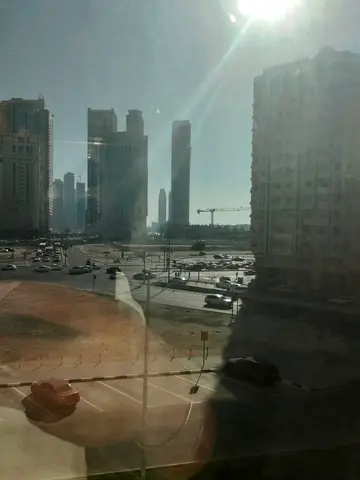 For rent in Al Majaz 2 Sharjah, a beautiful apartment with 2 spacious bedrooms and a living hall, central AC, 3 bathrooms, and 2 master bedrooms. Cle