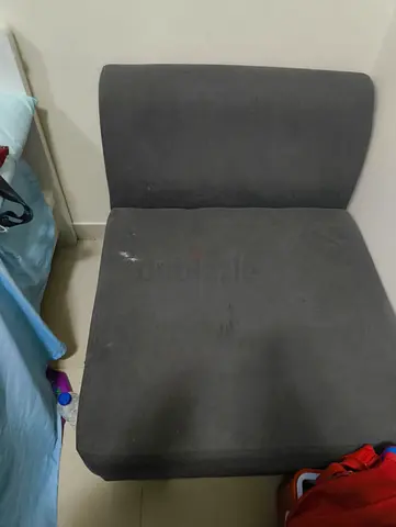 Single armless lounge chair - grey fabric (used)