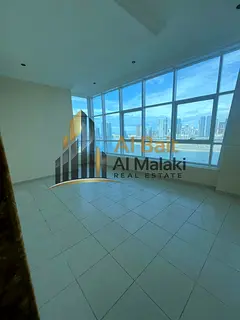 A one-bedroom apartment with a living room, two bathrooms, a sea view, and free parking.