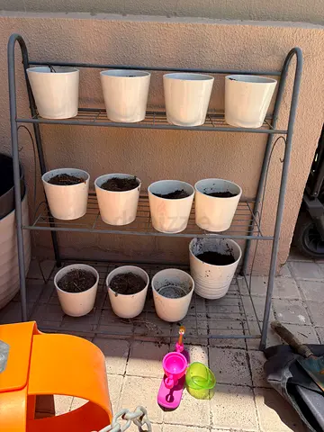 Free: Metal multi-tier plant stand with 12 ceramic pots
