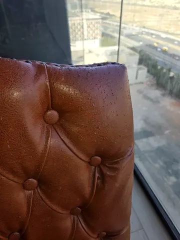 Brown Tufted Leather Ottoman / Footstool