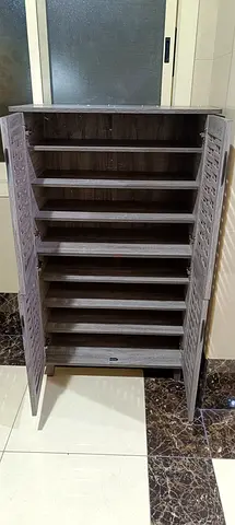We are selling 4 door wood shoe rack brand new