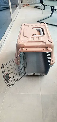 Used hard plastic pet carrier / travel crate with metal door - good condition last price 70aed.