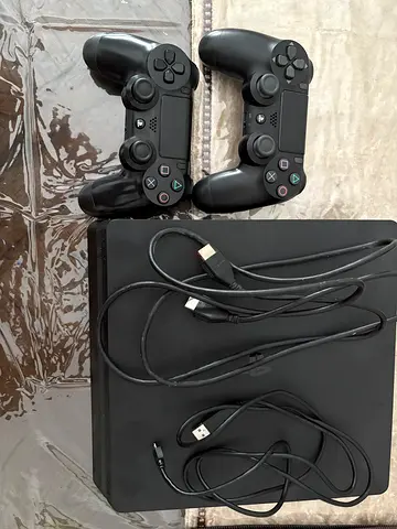 PlayStation 4 Slim with 2 Controllers and Games