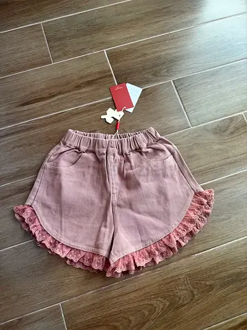 Girls dusty pink ruffle hem shorts - brand new with tags
