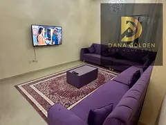 Two bedrooms, two living rooms, three bathrooms, and a balcony for monthly rent in Sharjah, Al Taawu