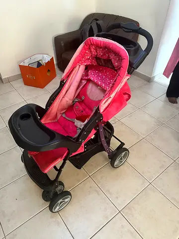 Pink baby stroller with - good condition