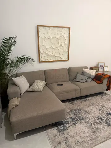 L-shaped grey fabric sofa