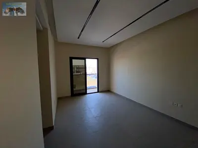 Two bedrooms and a living room, first occupancy, with balcony, built-in wardrobes, central air conditioning in Al Jurf