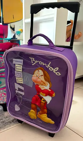 Kids purple rolling suitcase with cartoon character, small carry-on trolley