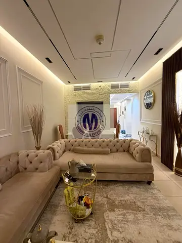 A spacious and luxurious three-bedroom apartment with a living room in Ajman One Towers is for sale.