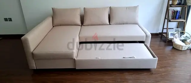 Beige L-shaped Sofa bed with Under-seat Storage and Pull-out Drawer - Good Condition