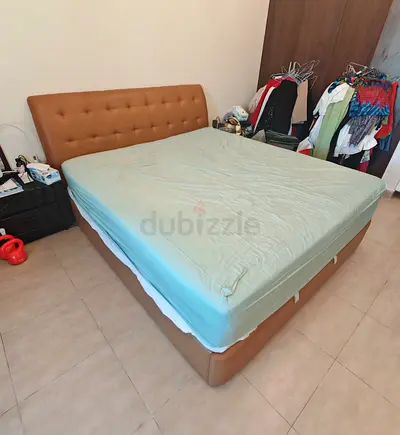 Leather king-size bed with mattress which has storage.