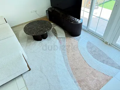 Modern abstract area rug in neutral tones - excellent condition