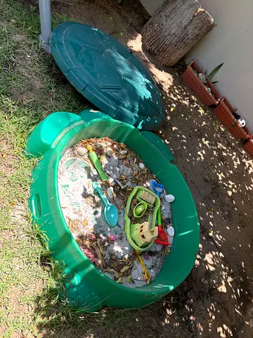 Free: Used Green Turtle Sandbox with Toys