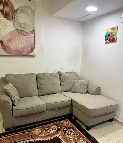 Light grey L-shaped 3-seater sofa with chaise