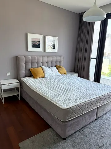 Gray upholstered king-size bed frame with mattress (good condition)