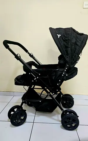 Good condition black baby stroller — lightweight everyday pram