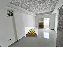 1BR apartment first tenant in Al Alia Ajman balcony 2 bathrooms central AC large area 35K yearly 4 p