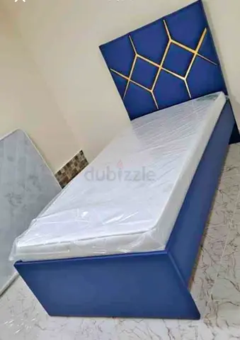 Brand New Single blue upholstered bed with geometric headboard and Mattress