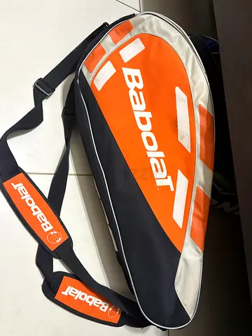 Genuine Babolat tennis bag. Multiple compartments for rackets and accessories. All zippers working.