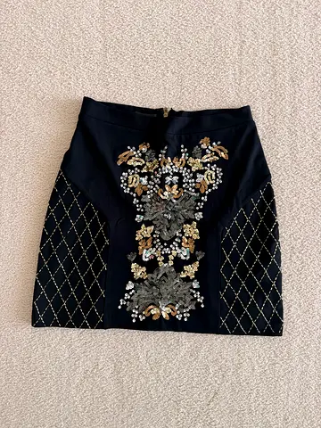 Black Embellished Mini Skirt with Sequin Floral Detail by Bebe