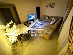 Two-bedroom apartment with a living room for monthly rent in Al Taawun area with free internet.