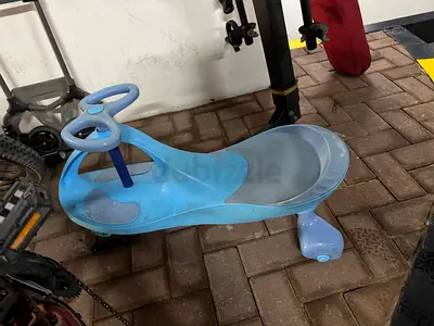 Blue Plasma Car / Wiggle Ride-On Toy – Good Used Condition