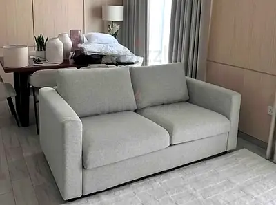 Light grey 2-seater fabric sofa in excellent condition