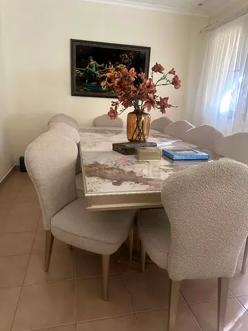Marble-top dining table with 10 upholstered chairs - excellent condition