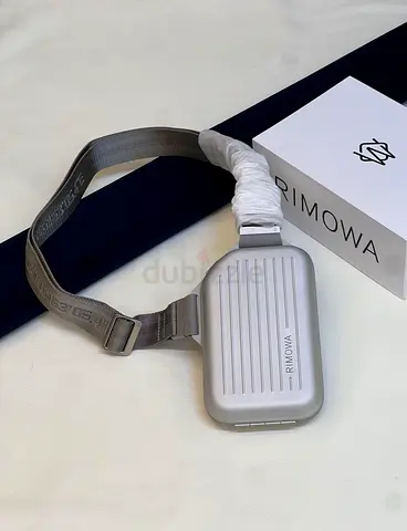 RIMOWA personal aluminum sling clutch