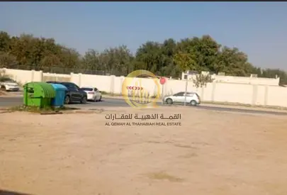 For sale: commercial land in Al Nahda, area 10,000 sq ft, permit for 5 basements + 15 floors