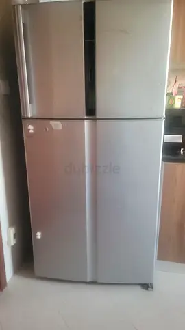 Silver double-door refrigerator in good working condition