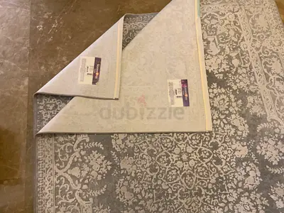 Light grey patterned area rug — 2 PIECES SALE FOR 1,000 AED