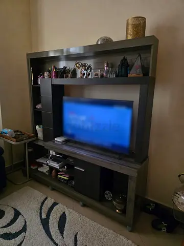 Dark wood entertainment center with shelves and storage - good condition