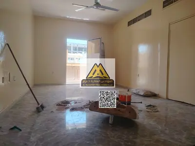 For annual rent in Al Nuaimiya 1: A spacious two-bedroom apartment with two master bedrooms and an open balcony at a special price.