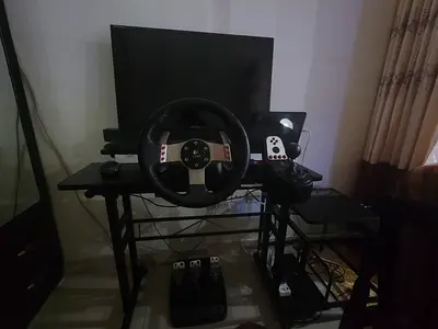 Logitech G27 gaming wheel, pedals and shifter.