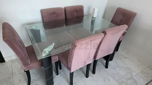 Glass Top Dining Table with 6 Pink Velvet Chairs - Used Condition