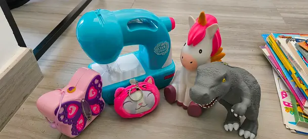 Kids toy bundle: pretend sewing machine, unicorn, dinosaur  accessories