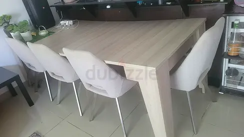 Light wood dining table without chair  --- extendable .